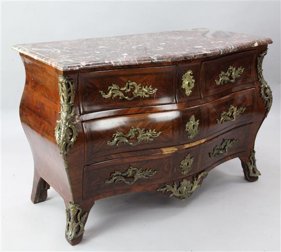 A Louis XVI ormolu mounted kingwood bombe commode, W.4ft 4in. D.2ft 1in. H.2ft 10in. (top a.f)